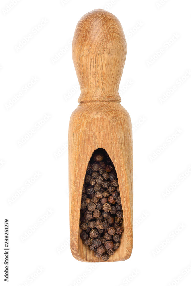 Black peppercorn in a wooden scoop isolated on white background. Top view Black peppercorn in a wooden scoop isolated on white background. Top view