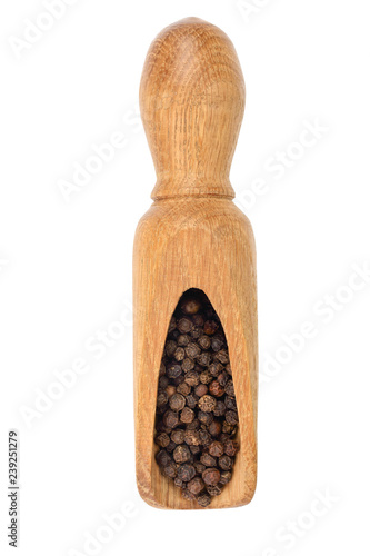 Black peppercorn in a wooden scoop isolated on white background. Top view