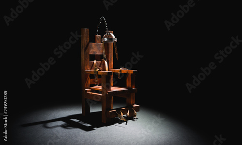 Electric chair in a dark background photo