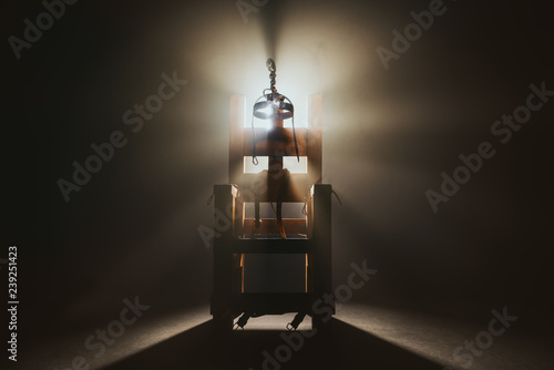 Electric chair in a dark background photo