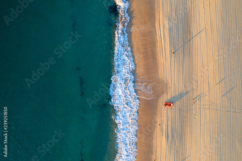 Sand with boat and ocean - Verticle