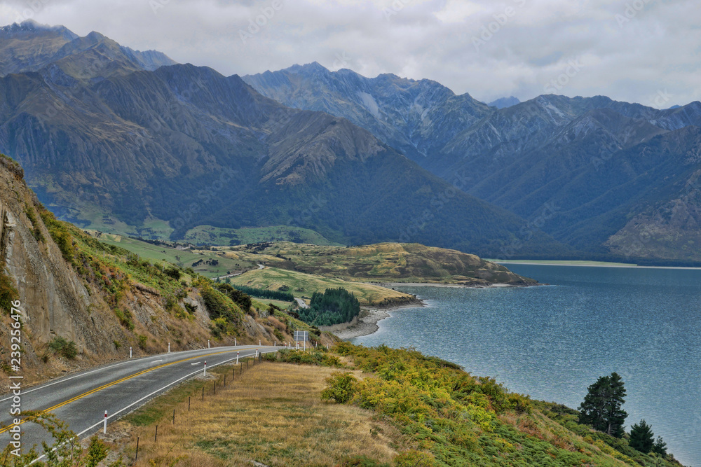 Adventurous lakeside drive by a lake in the New Zealand mountains 