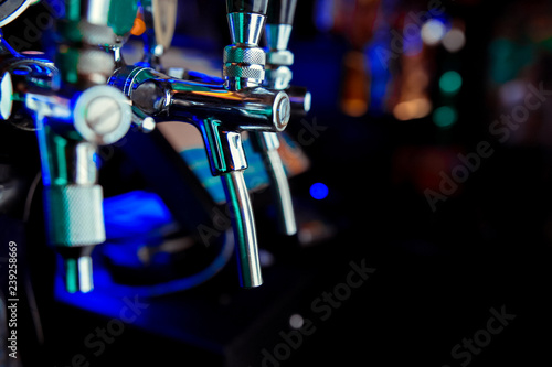 Canvas Print The beer taps in a pub