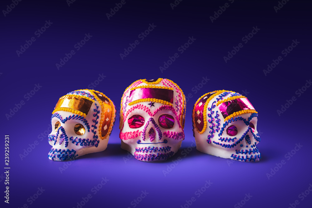 sugar skull in a purple background