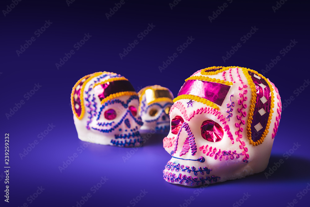 sugar skull in a purple background