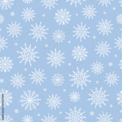 Vector seamless pattern with doodle snowflakes. Hand drawn winter background.