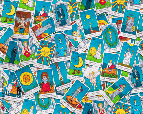 Tarot cards distributed randomly on top of each other