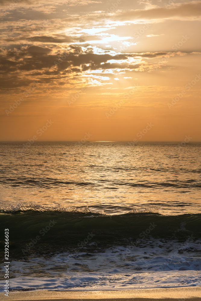 Sunset on Atlantic ocean, Nazare, Portugal.