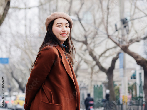 Photography Beautiful young brunette woman posing with blur street background