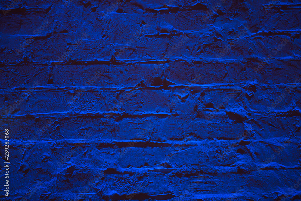 Fototapeta premium Grunge neon blue brick wall texture background. Magenta colored brick wall texture architecture pattern.