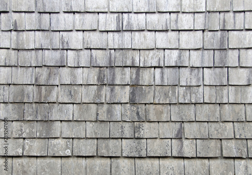 The old coating of wooden tiles