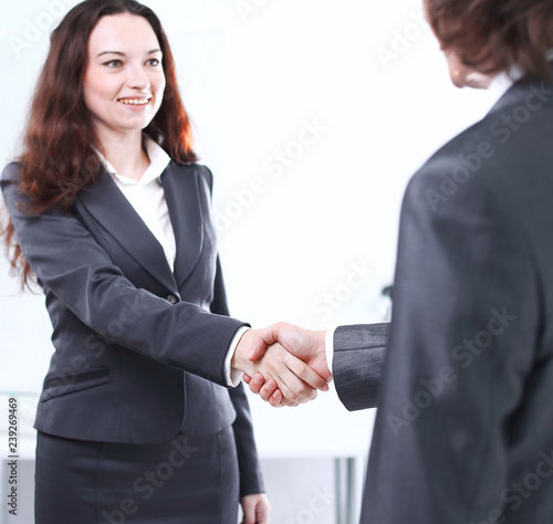 business woman welcomes the business partner's handshake