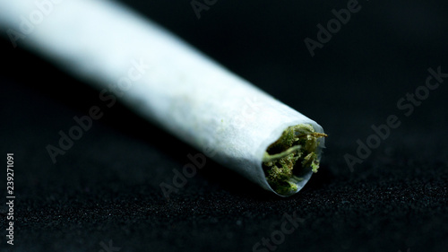 marijuana weed cigar join in black background