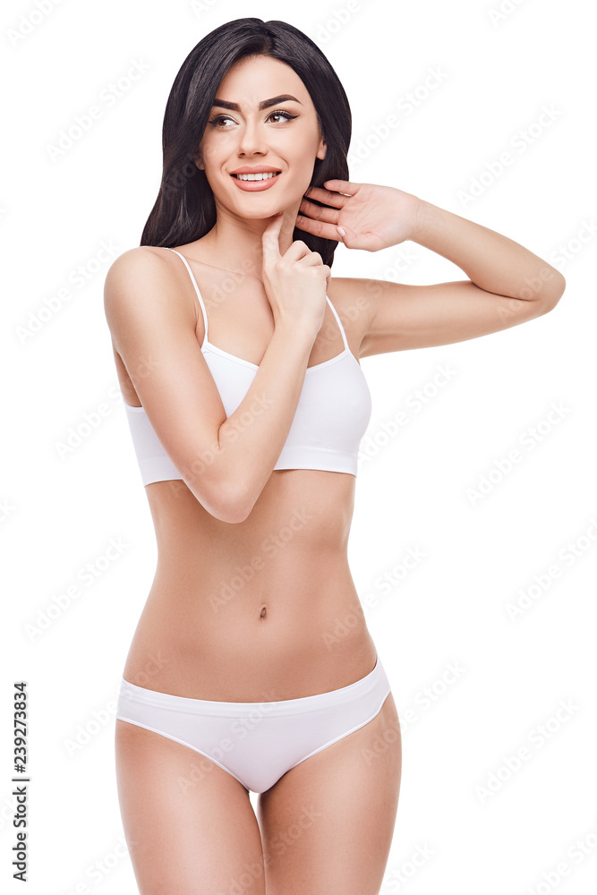 Fototapeta premium beautiful female legs with white panties on white background