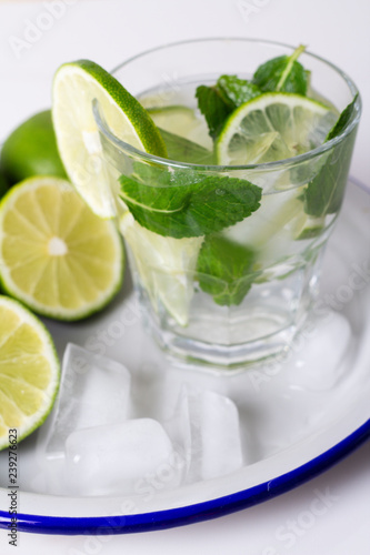 drink, water, mojito lime and mint with ice on a tray.