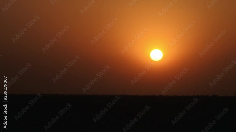 A long shot of a sun setting down over jaisalmer A long shot of a sun setting down over jaisalmer