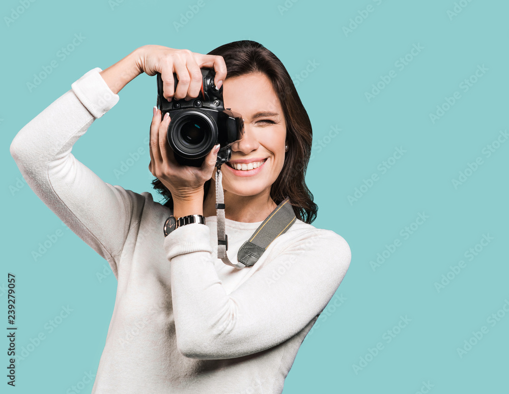 Woman photographer takes images with dslr camera Woman photographer takes images with dslr camera