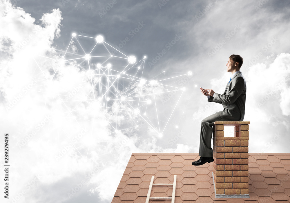 Man on roof with smartphone and concept of social connection Man on roof with smartphone and concept of social connection