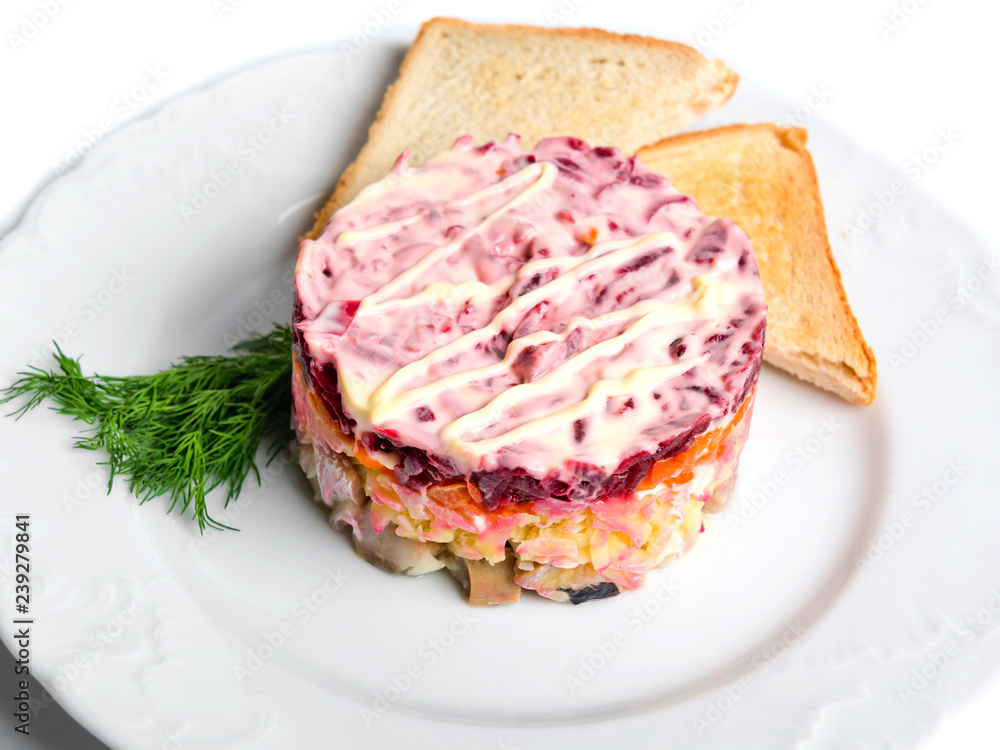 Salad herring under a fur coat, isolated on white background. Salad herring under a fur coat, isolated on white background.