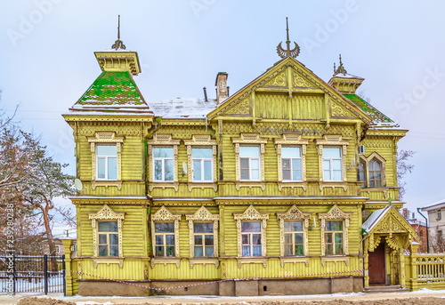 Old wooden house in the old Russian style decorated with wood carvings