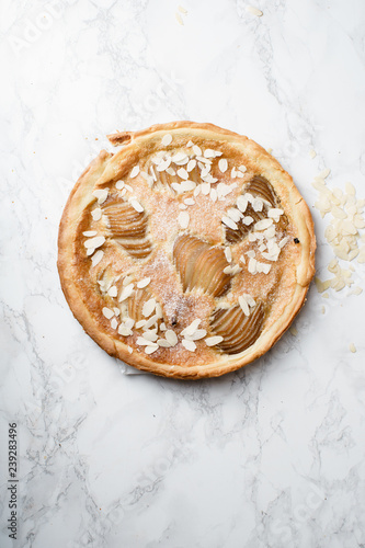 Tart with poached pears and almond frangipane photo