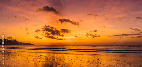 Jimbaran Beach Bali sun set near International Ngurah Rai Airport, located at Pantai Kedonganan Jimbaran Central fish market photo