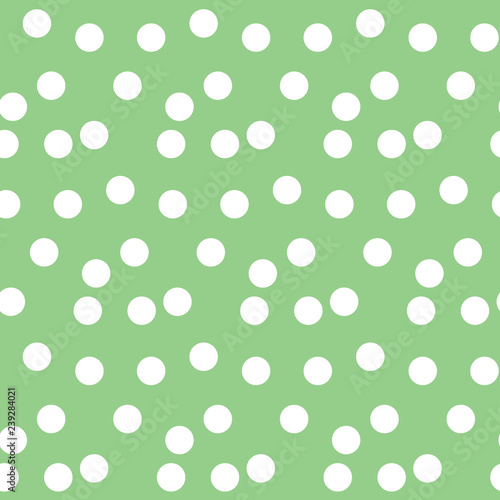 Pastel green background scattered dots polka seamless pattern