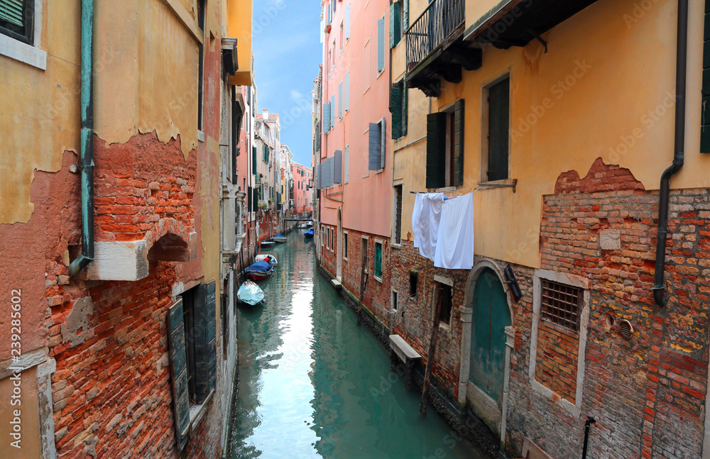 narrow navigable canal in Venice in Italy