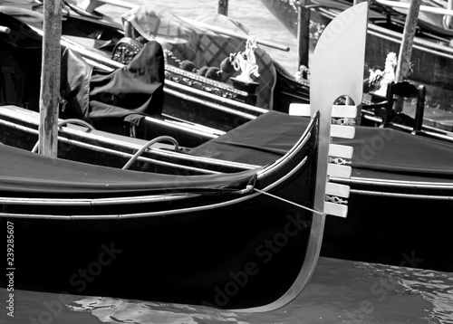 boat to transport tourists to Venice in Italy called Gondola moo photo