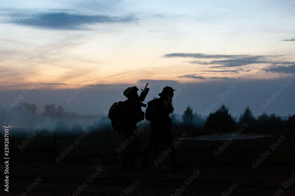 silhouette action soldiers walking hold weapons the background is smoke and sunset and white balance ship effect dark art style silhouette action soldiers walking hold weapons the background is smoke and sunset and white balance ship effect dark art style