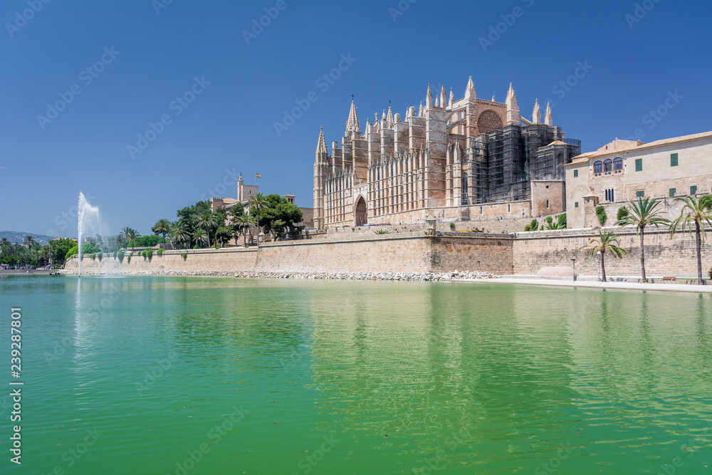 Palma de Mallorca, Balearic Islands, Spain - July 21, 2013: Royal Palace of La Almudaina and Cathedral of St. Mary of Palma