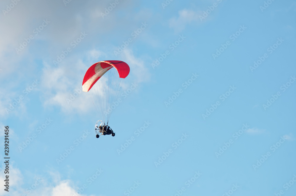 A hang glider in flight with a blue sky 3 A hang glider in flight with a blue sky 3