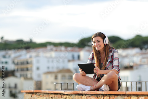 Teenage girl e-learning looking at camera