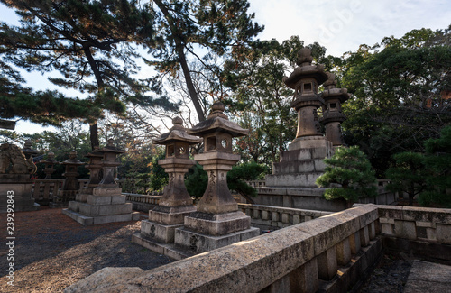 Ancient stone lanterns outside Japanese shrine
