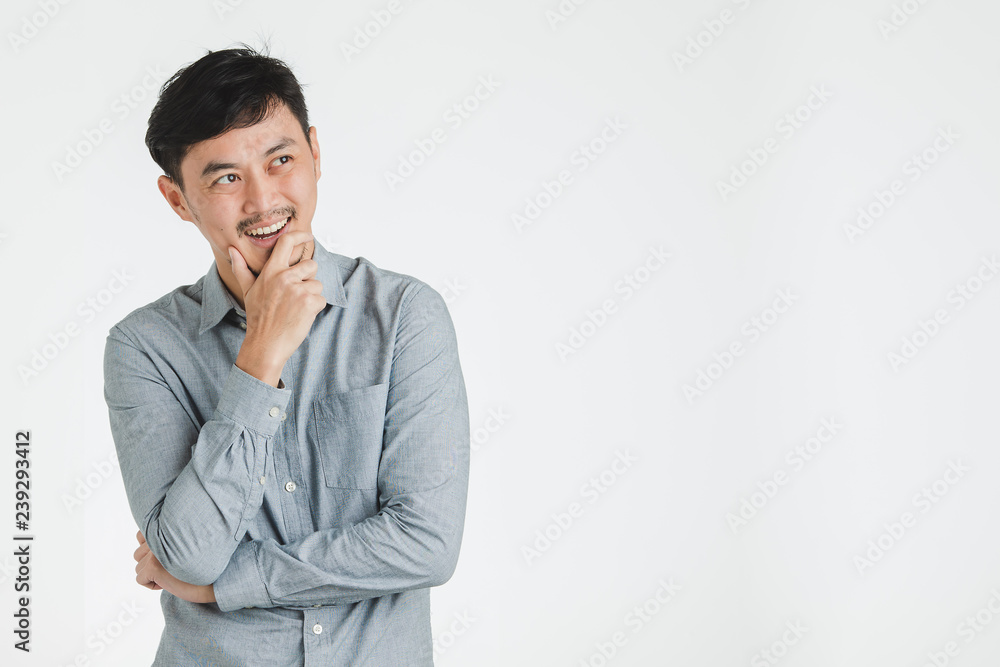 Happy man seems thinking or wish for some good things. Happy man seems thinking or wish for some good things.