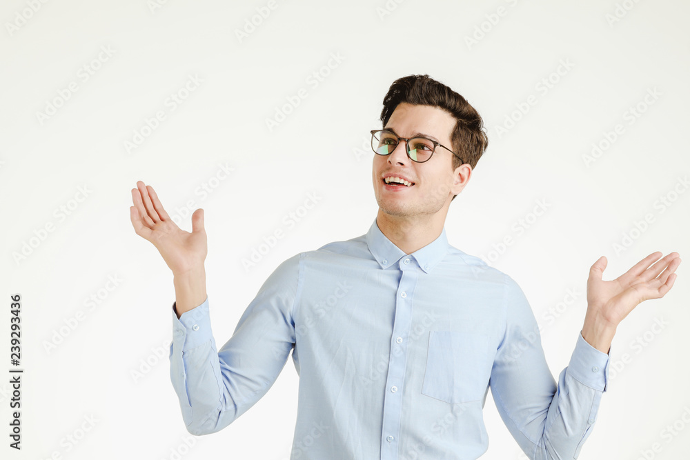 Young man in action of questioning or wondering. Young man in action of questioning or wondering.