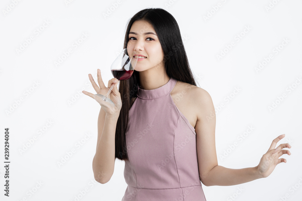 Happy young woman drinking and dancing.