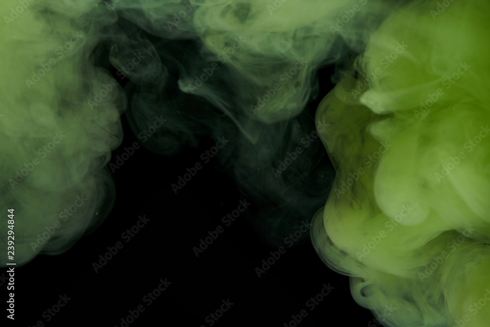 Fototapeta premium Green ink and black background