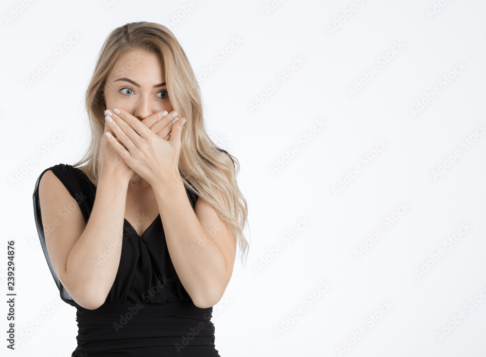Beautiful woman covering mouth by her hands. Beautiful woman covering mouth by her hands.