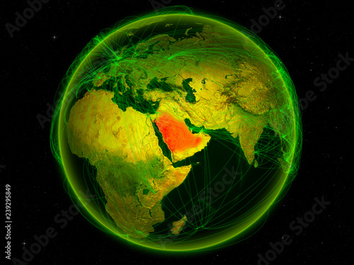 Saudi Arabia from space on planet Earth with digital network representing international communication, technology and travel.