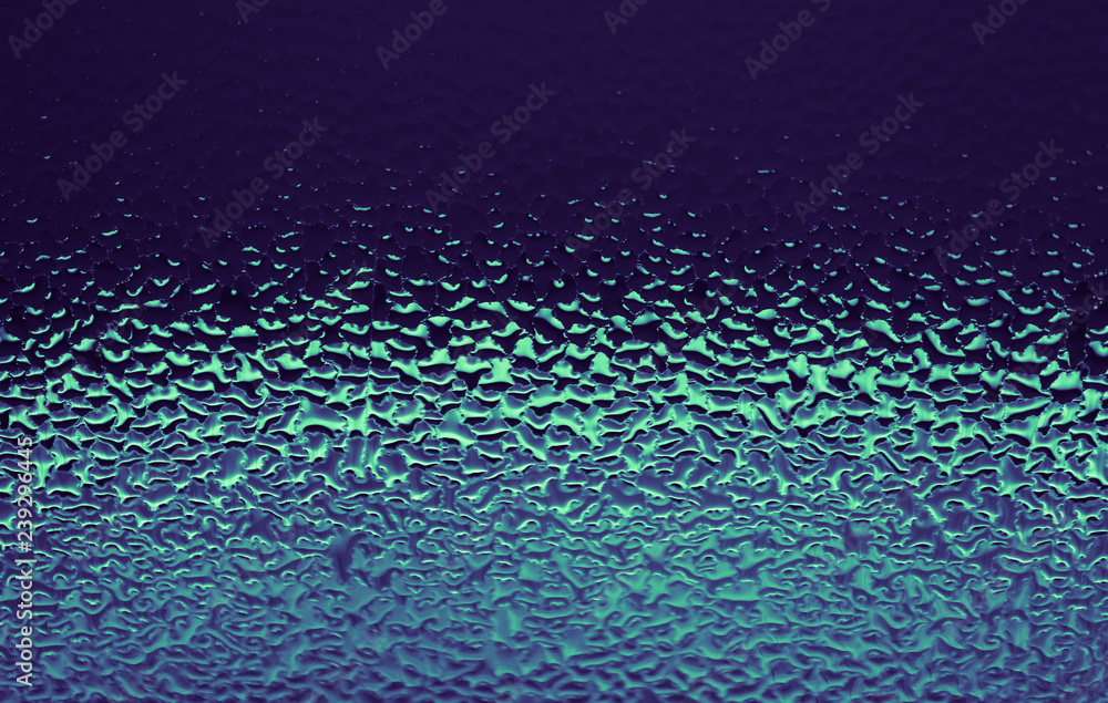 Obraz premium Blue abstract water drops background. Violet green wet glass, condensate texture background.