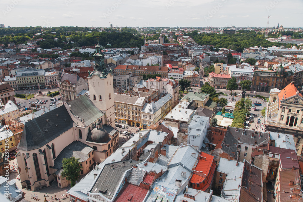 Lviv cityscape and view of the Latin Cathedral - a landmark Roman Catholic Cathedral, dating from the 14th century. Photo of the old roofs of the city of Lviv with the town hall.