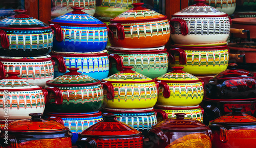 Traditionally decorated colorful souvenir pots in tourist shop, Bulgaria.