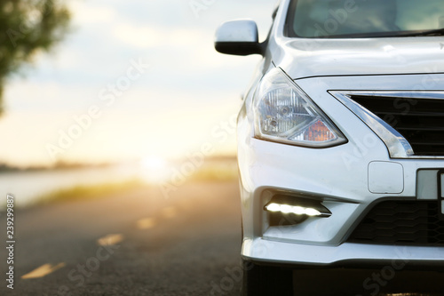 Car Blonde traveling in nature on an asphalt road 