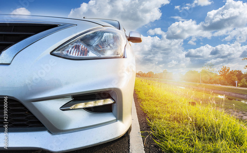 Car Blonde traveling in nature on an asphalt road 