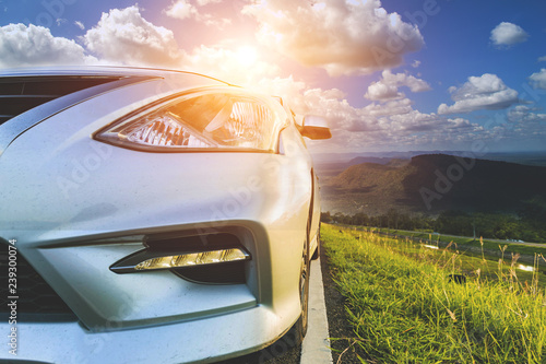 Car Blonde traveling in nature on an asphalt road 