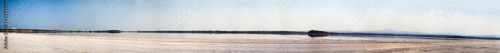 Beautiful view of the city panorama from the shore of a salty lake on the island of Cyprus