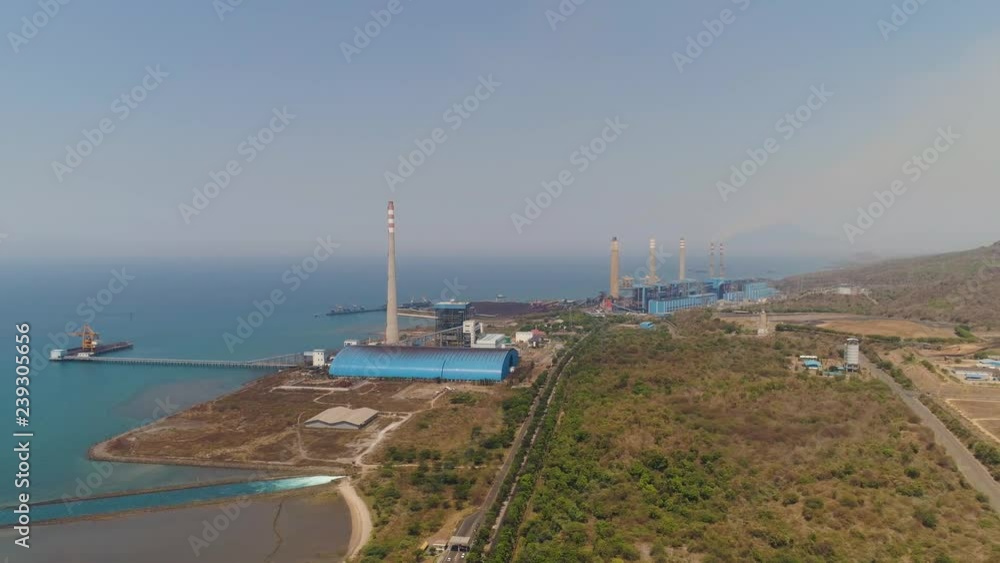 power station by sea with smoking pipes, paiton java, indonesia. aerial view power plant in asia. power station by sea with smoking pipes, paiton java, indonesia. aerial view power plant in asia.