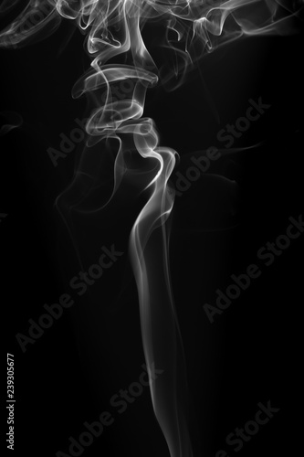 Movement of white smoke on black background © jintana