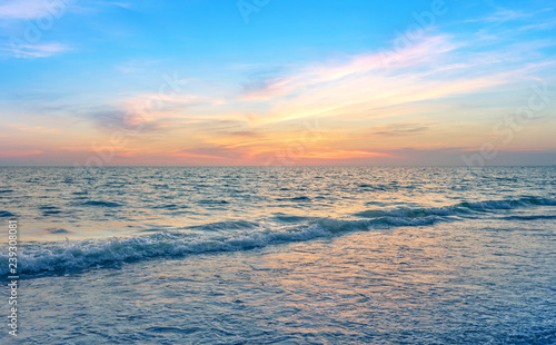 calmness seascape in colorful sunset sky